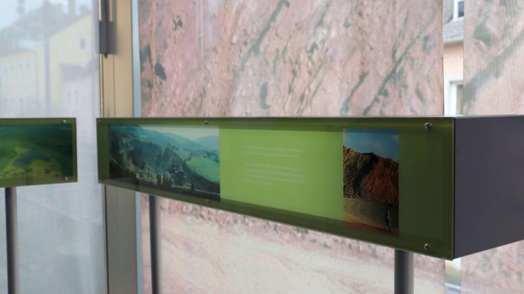 An informative exhibition with images and texts about landscapes. The displays are designed in a modern style.