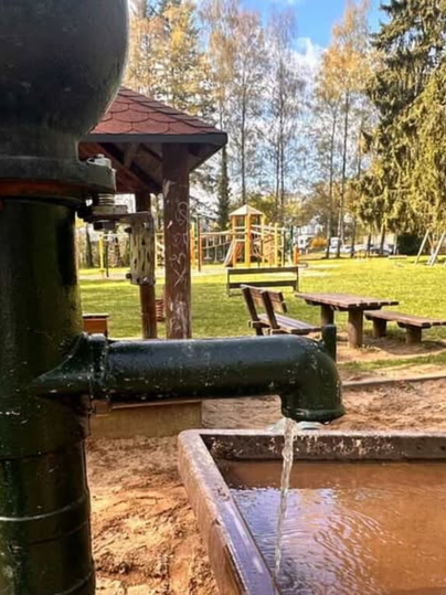 Children's playground in the spa park with water