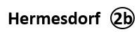 Texte noir 'Hermesdorf 2b' sur fond blanc, o&ugrave; '2b' est inscrit dans un cercle.